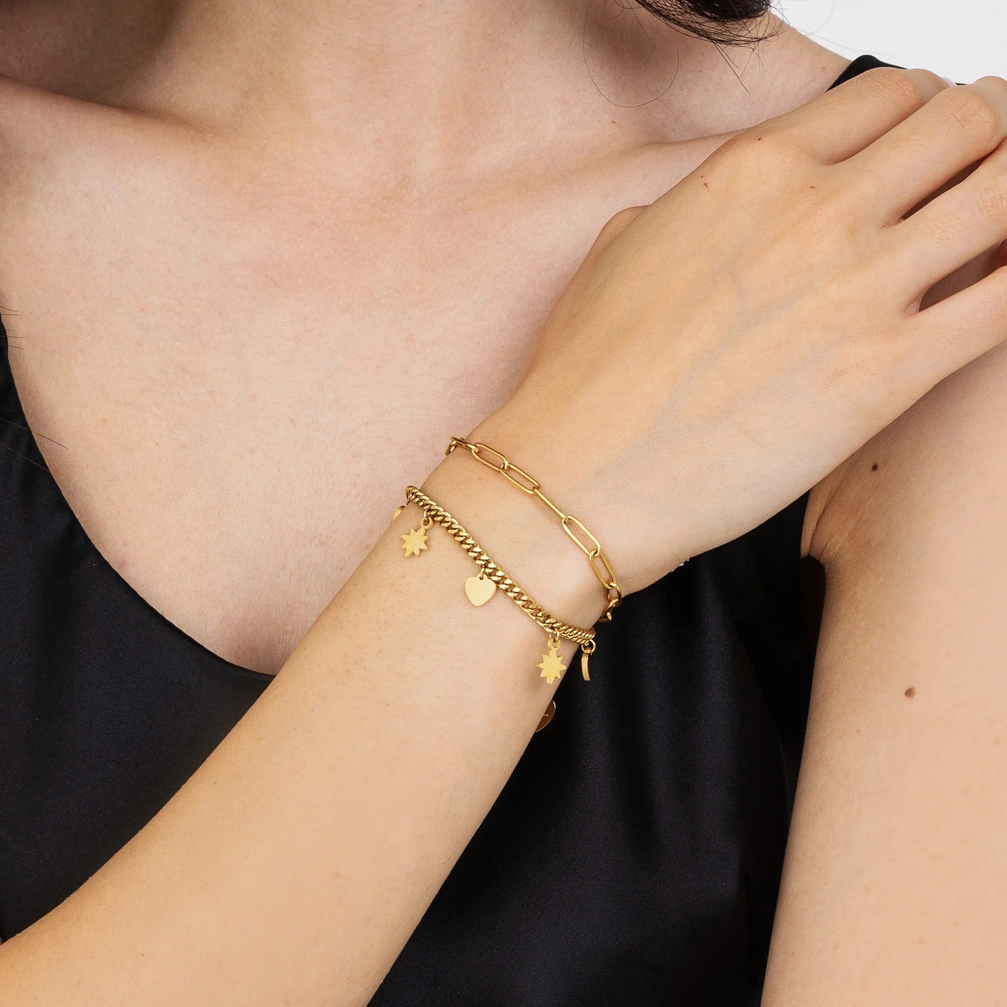 Bracciale in acciaio dorato con cuori e stelle