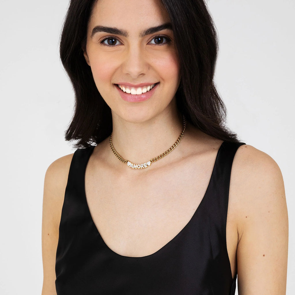 Collana in acciaio dorato amore con cristalli bianchi