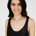 Collana in acciaio dorato amore con cristalli bianchi