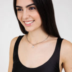 Collana in acciaio con luna e cristalli bianchi