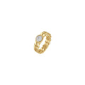 Anello in acciaio dorato con cristalli bianchi